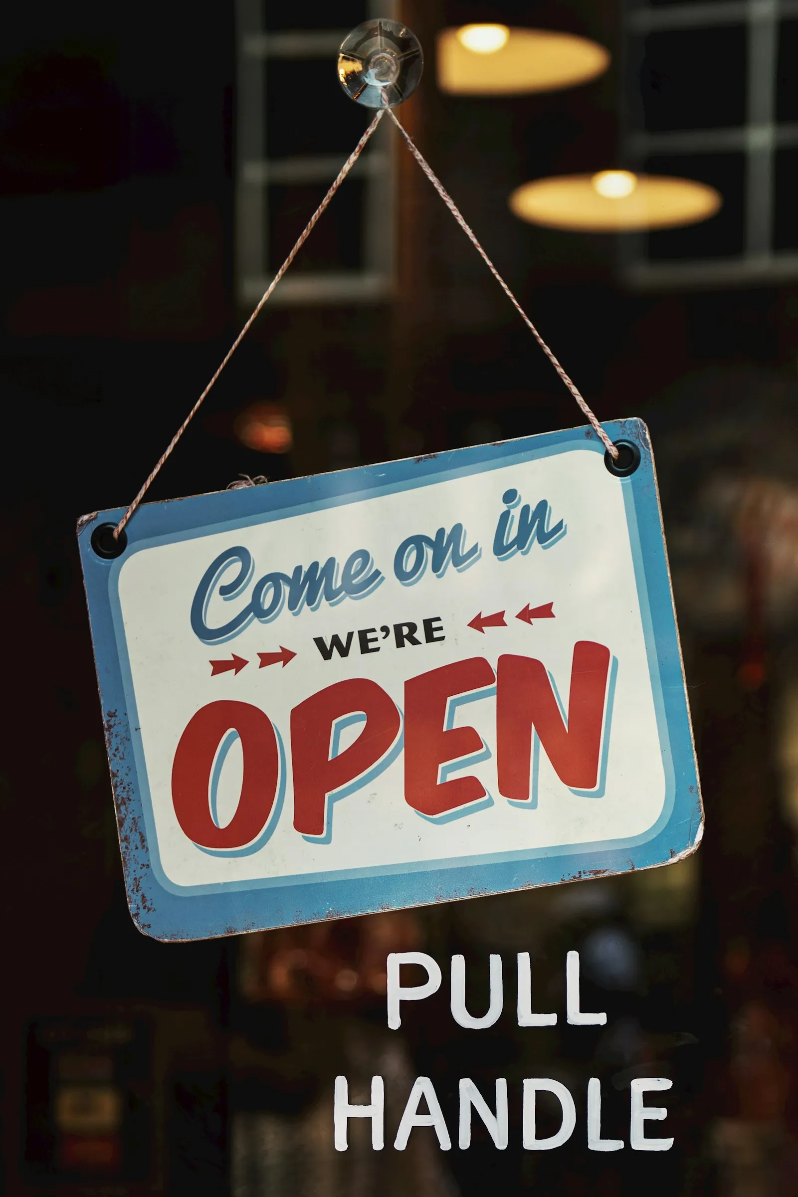 An independent small business storefront with an open sign, the kind of local business that lives or dies by deliberate customer acquisition.