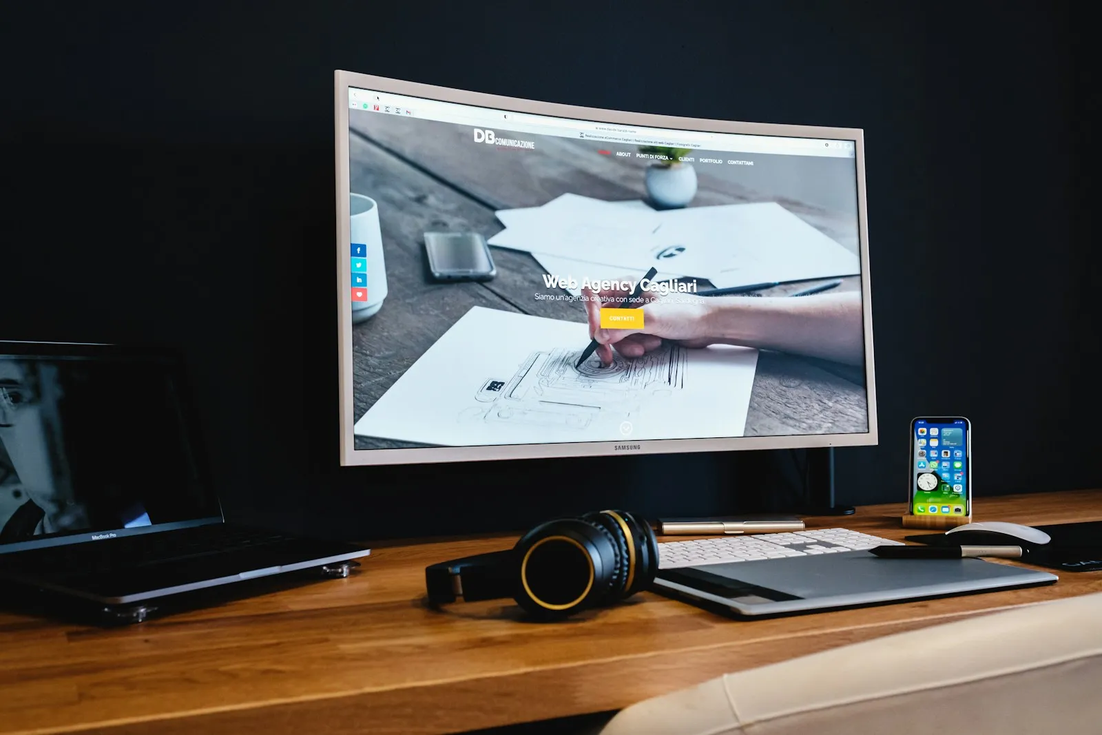 A web designer’s workspace with a monitor displaying a clean website layout, the kind of working environment behind a Scottsdale or Cave Creek small business site build.