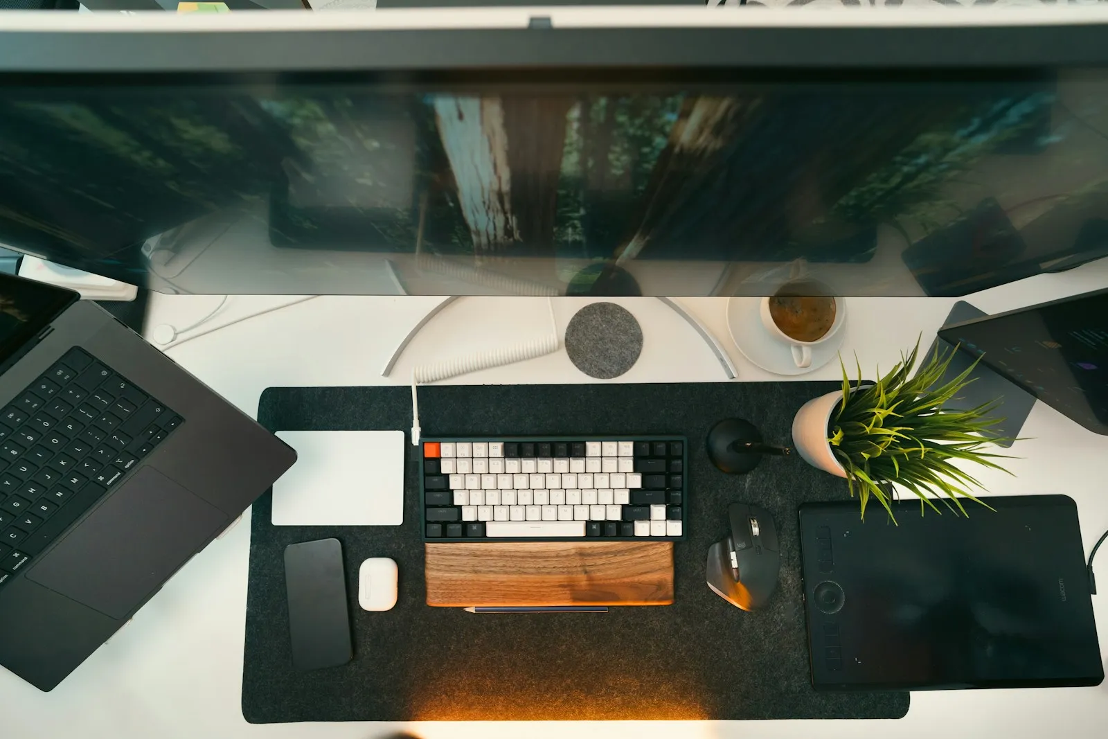 A clean modern designer workspace with dual monitors, the kind of setup a Phoenix web design company uses to build small business websites.